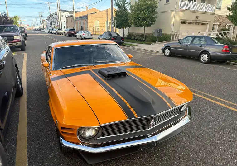 The same 1970 Ford Mustang Fastback parked on a street at delivery in Wildwood, New Jersey