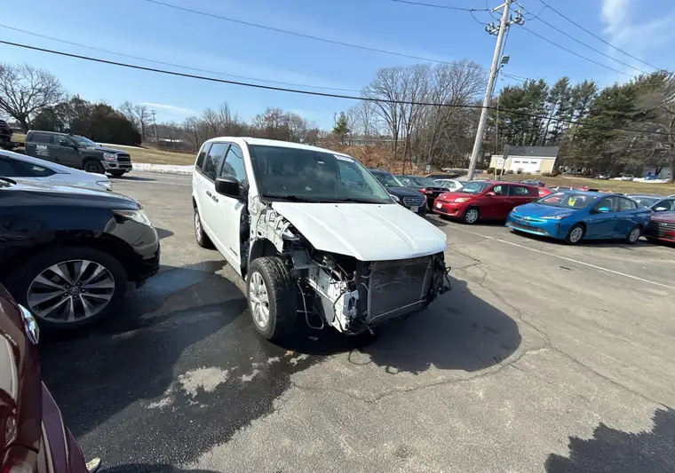 The same Dodge Grand Caravan in a parking lot at delivery in Worcester, Massachusetts