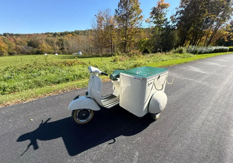 The same 1965 Vespa with sidecar parked on a country road at delivery in Connecticut