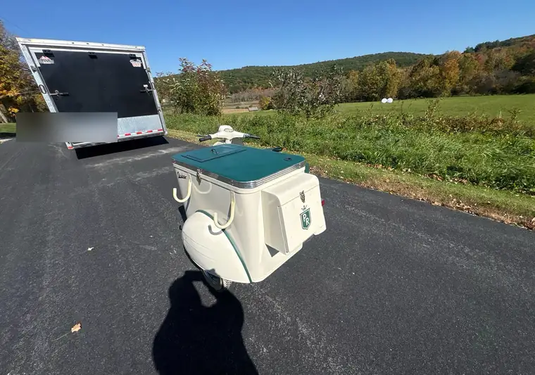 The same Vespa with its sidecar on a country road at delivery in Connecticut, with the enclosed trailer behind it