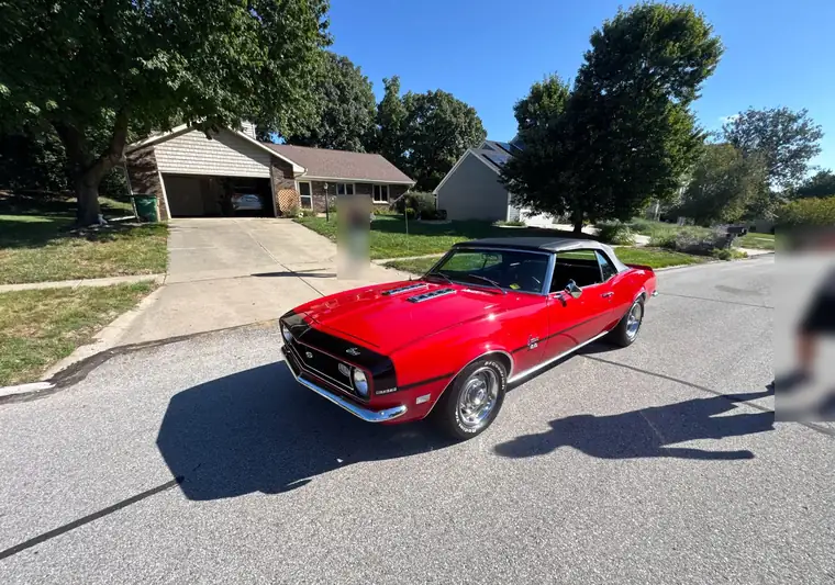 The same Camaro convertible on a residential street at delivery in West Des Moines, Iowa
