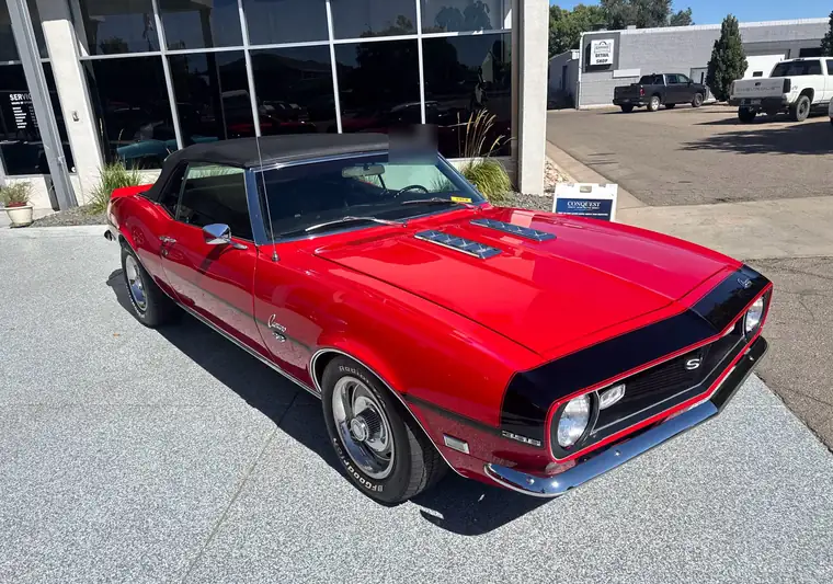 Red 1968 Chevrolet Camaro convertible with a black top at pickup in Greeley, Colorado