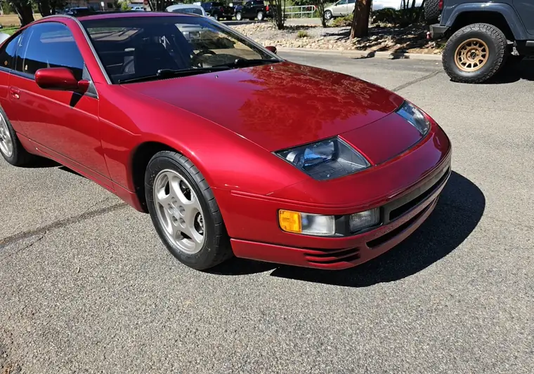 Red 1990 Nissan 300ZX at pickup in a Boulder, Colorado parking lot
