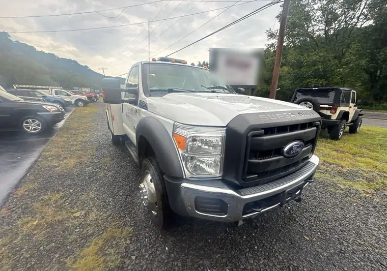 The same Ford F-550 service truck on a gravel lot at delivery in Pennsylvania