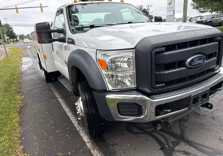 White 2012 Ford F-550 service truck with a utility body at pickup in Plainville, Connecticut