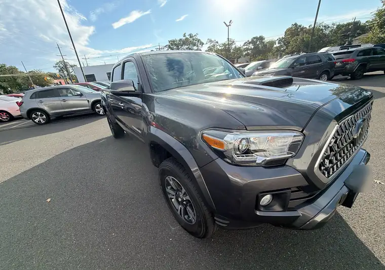 The same Toyota Tacoma in a dealership lot at delivery in Point Pleasant, New Jersey