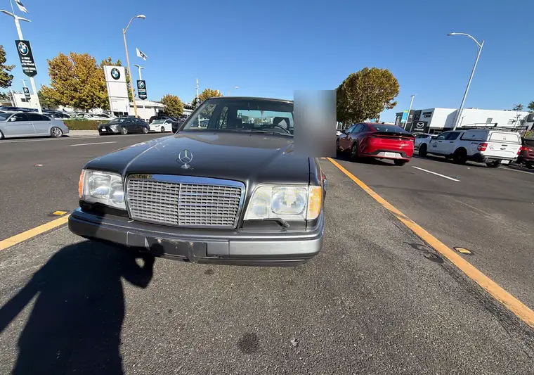 The same Mercedes E-Class on a dealership lane at delivery in San Jose, California