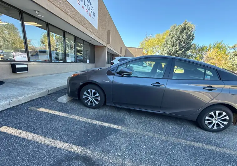 The same Prius in a parking lot at delivery in Boulder, Colorado