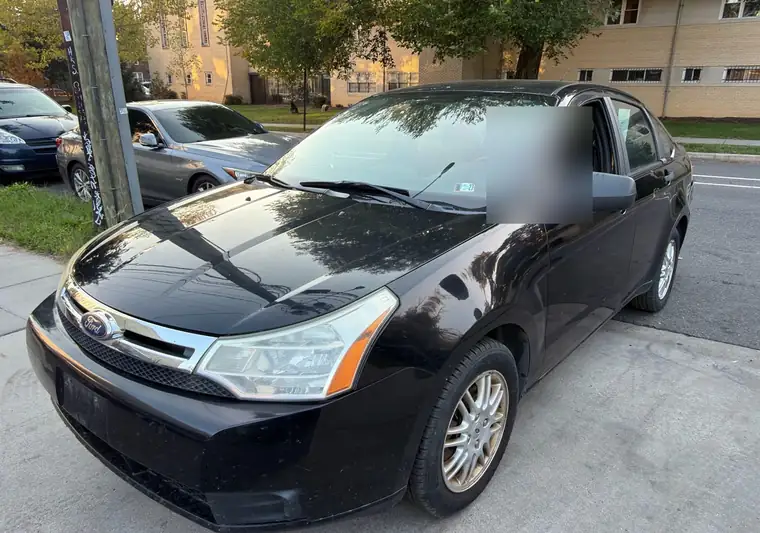 The same Ford Focus parked on a street at delivery in Washington, DC