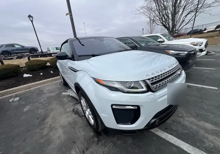 White 2018 Range Rover Evoque convertible with a black soft top in a parking lot in Merriam, Kansas
