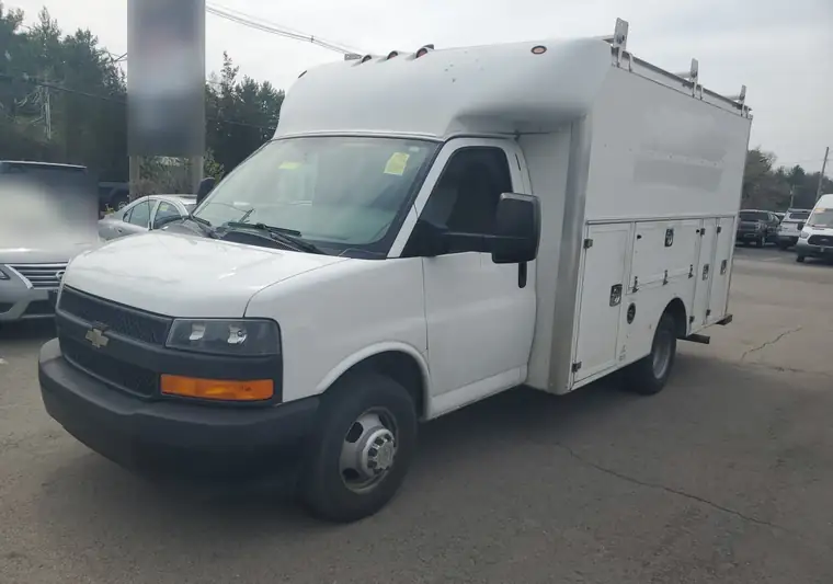 The same Chevrolet Express utility van at a dealer lot at delivery in Rowley, Massachusetts