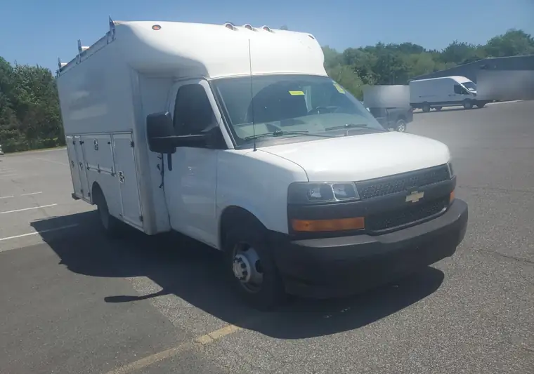 White 2018 Chevrolet Express 3500 utility van with a service body at pickup at a dealership in Seaford, Delaware
