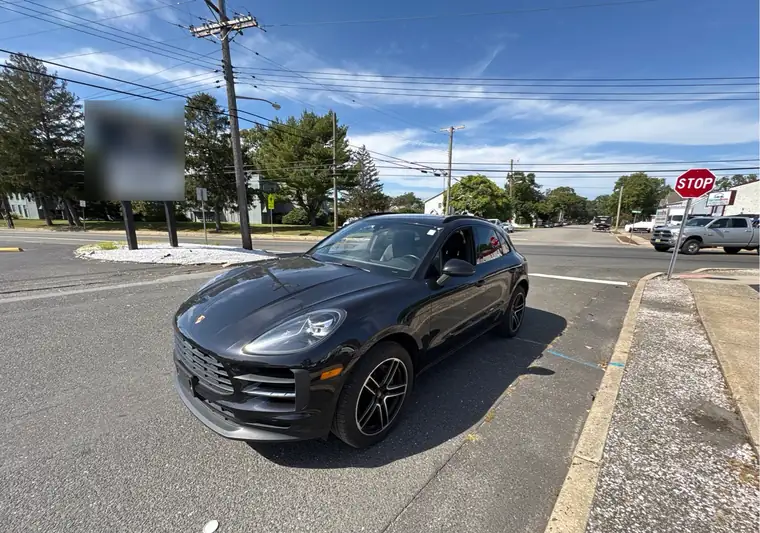 The same Porsche Macan on a street at delivery in Point Pleasant, New Jersey