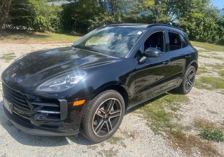 Black 2020 Porsche Macan on a gravel lot at pickup in Newark, Delaware