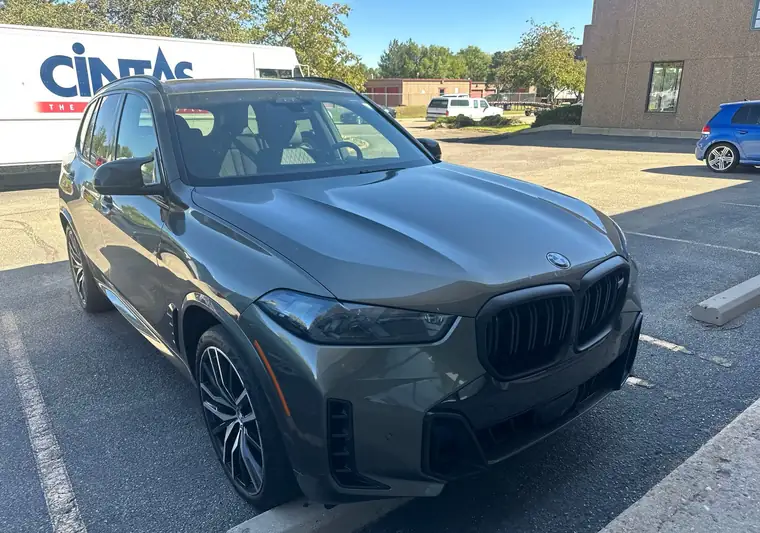 The same BMW X5 in a parking lot at delivery in Boulder, Colorado