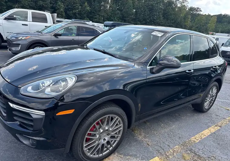 Black 2018 Porsche Cayenne at pickup in an auction lot in College Park, Georgia