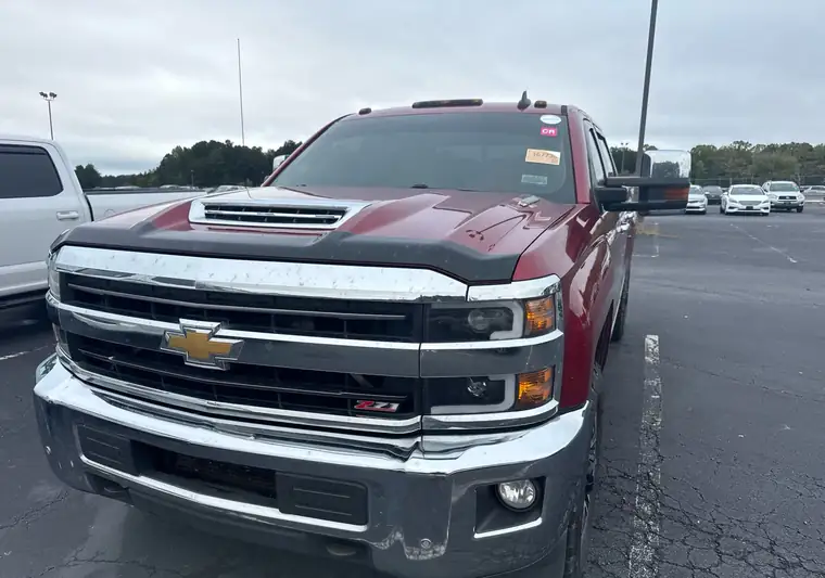 Red 2018 Chevrolet Silverado 2500HD Z71 at pickup in a lot in Fairburn, Georgia