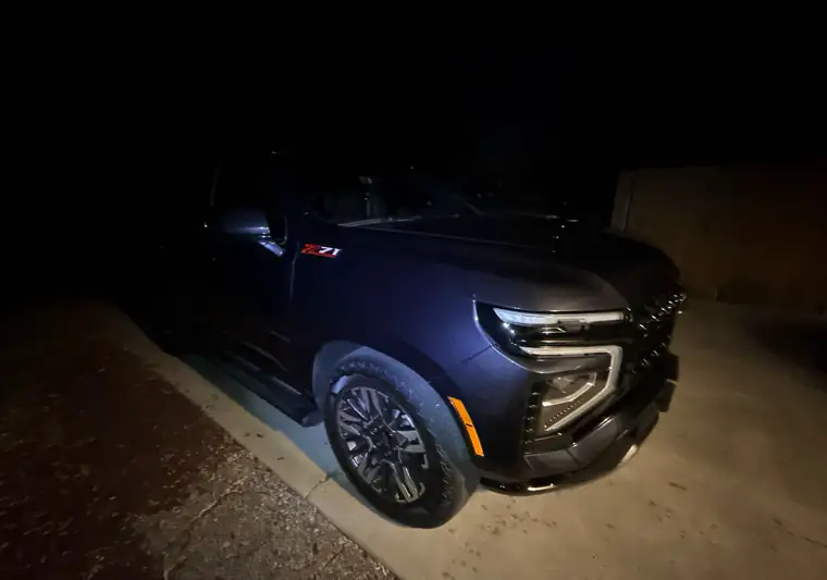 Dark blue 2025 Chevrolet Tahoe Z71 at night at pickup in Boise, Idaho