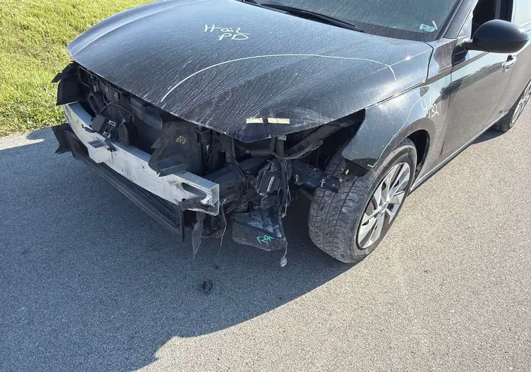 The same Nissan Altima on a driveway at delivery in De Soto, Iowa