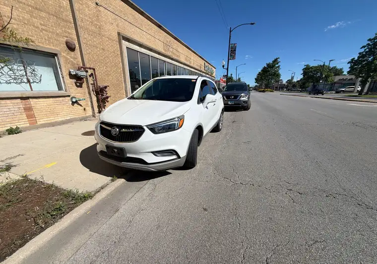 White 2019 Buick Encore parked on a street in Chicago, Illinois