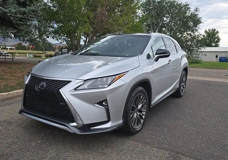 The same Lexus RX 450h on a street at delivery in Boulder, Colorado