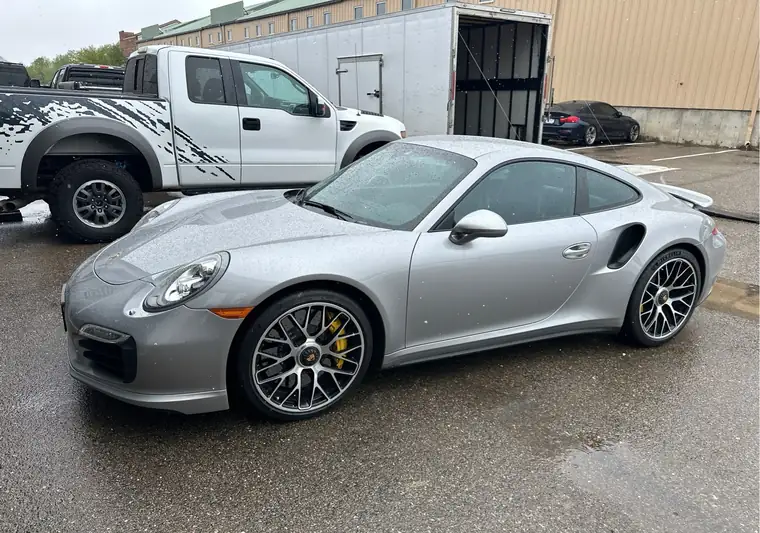 The same Porsche 911 in the rain at delivery in Boulder, Colorado