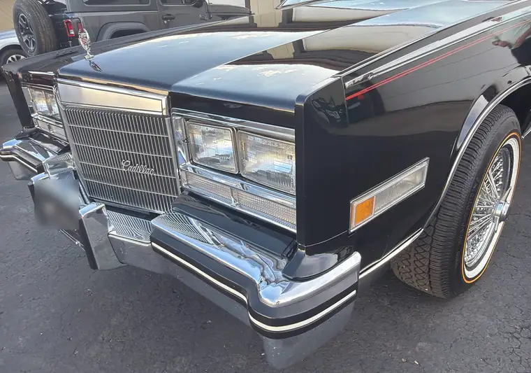 Front of a black 1985 Cadillac Eldorado with wire wheels at pickup in Auburn, Indiana