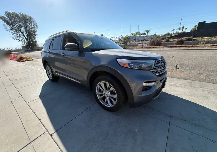 The same Ford Explorer on a sidewalk at delivery in Riverside, California