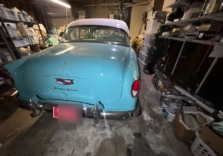 The same Chevrolet Bel Air in a garage at delivery in Buena Park, California
