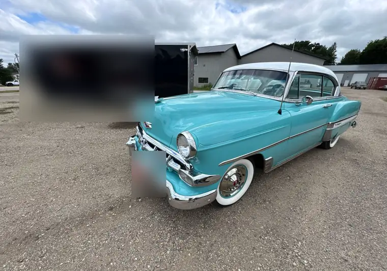 Turquoise 1954 Chevrolet Bel Air with a white roof at pickup in Spirit Lake, Iowa