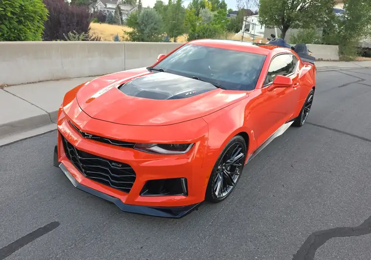The same Chevrolet Camaro on a street at delivery in Orem, Utah