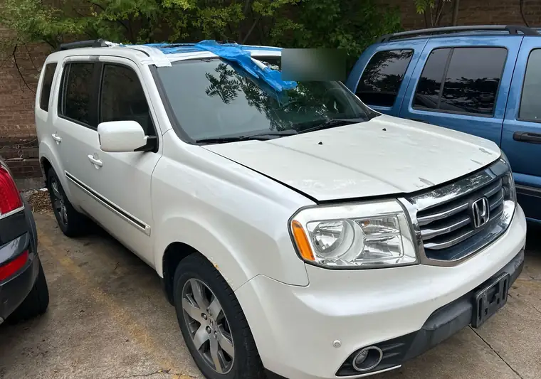 The same Honda Pilot in a parking lot at delivery in Chicago, Illinois