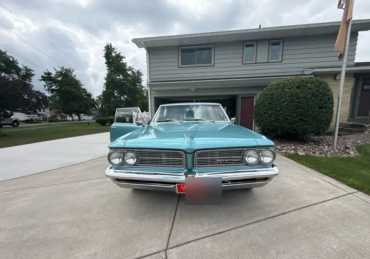 The same Pontiac LeMans in a driveway at delivery in Lewiston, New York