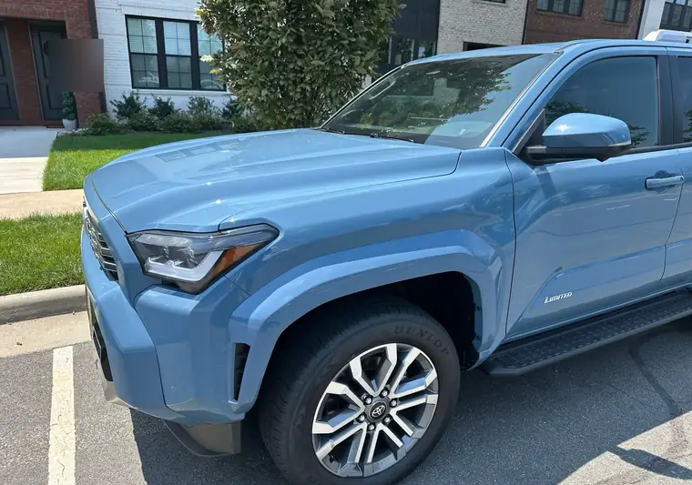 The same Toyota 4Runner parked at the curb at delivery in Broadlands, Virginia