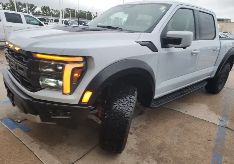 White 2025 Ford F-150 pickup on a dealership lot in Manhattan, Kansas