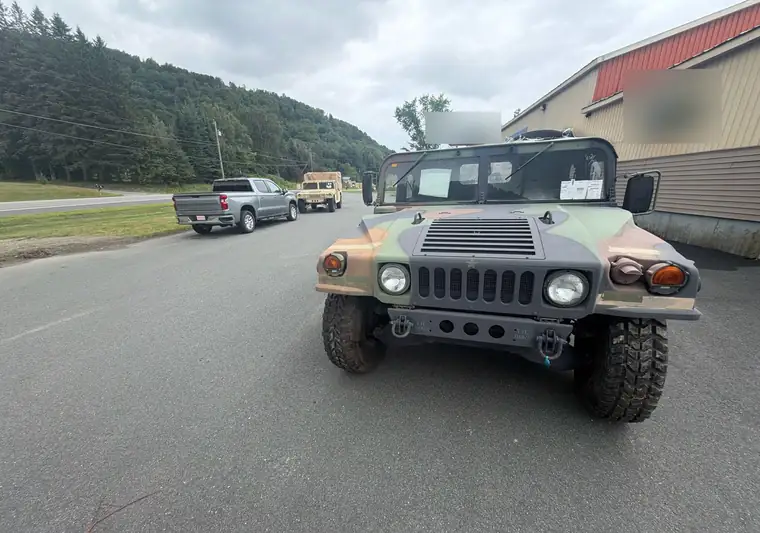 The same Humvee on a paved lot at delivery in Colebrook, New Hampshire