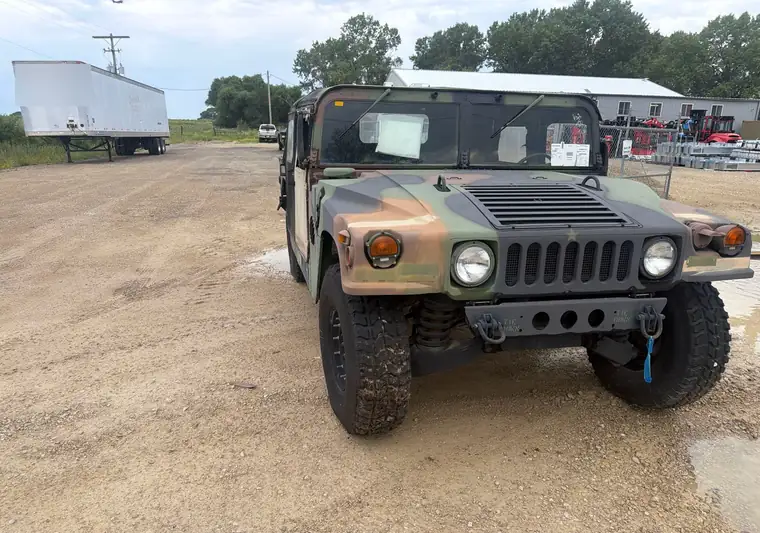 Camouflage 2008 AM General M1097R1 Humvee on a gravel lot in Abilene, Kansas