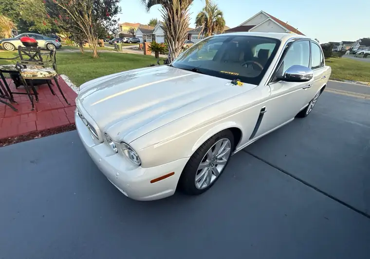 The same Jaguar XJ in a driveway at delivery in Pensacola, Florida