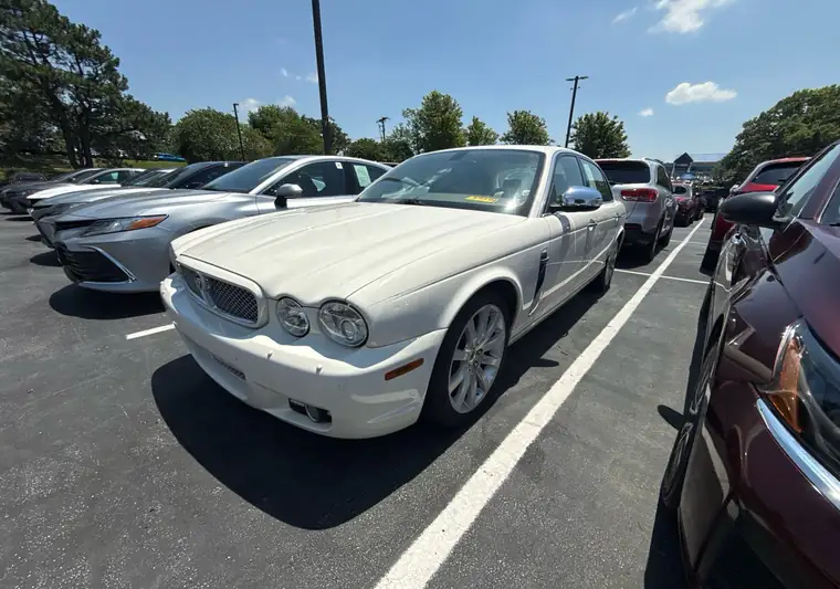 White 2008 Jaguar XJ sedan in a dealership parking lot in Mission, Kansas