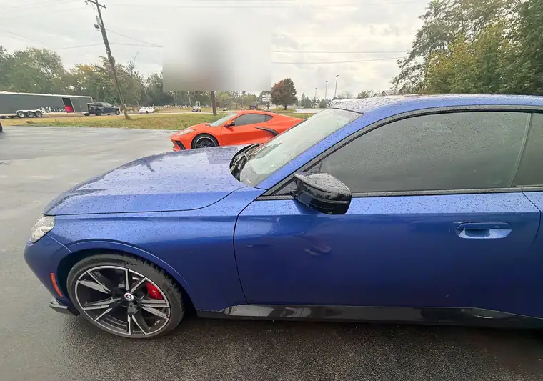 Blue 2023 BMW M240i coupe in a parking lot in Jamestown, Kentucky