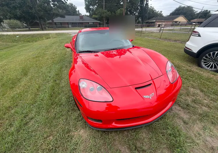 The same Corvette on a lawn at delivery in Baytown, Texas