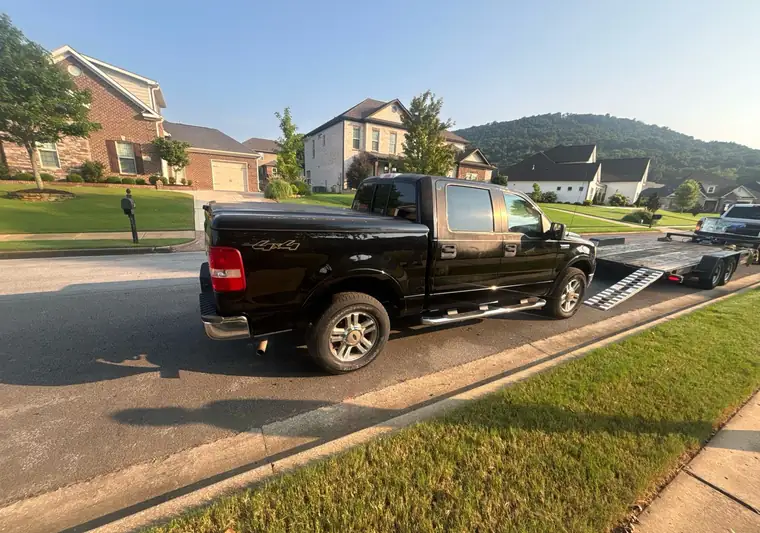 The same Ford F-150 on a residential street at delivery in Huntsville, Alabama