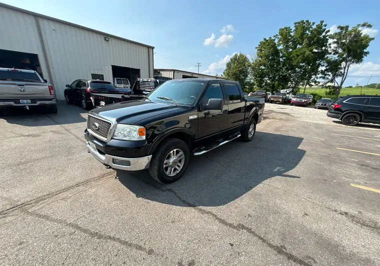 Black 2005 Ford F-150 crew cab in a parking lot in Frankfort, Kentucky