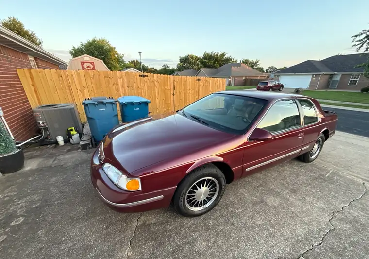 The same Mercury Cougar in a driveway at delivery in Pea Ridge, Arkansas
