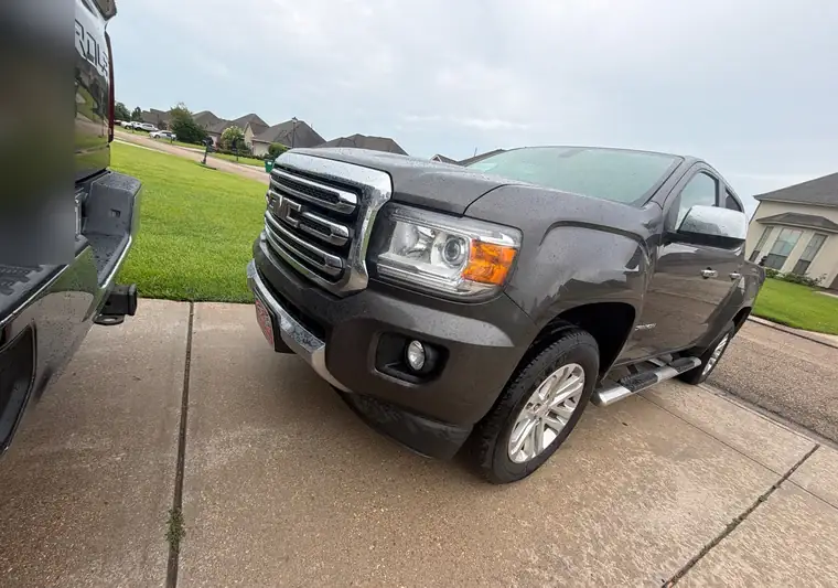 The same GMC Canyon in a driveway at delivery in Sorrento, Louisiana