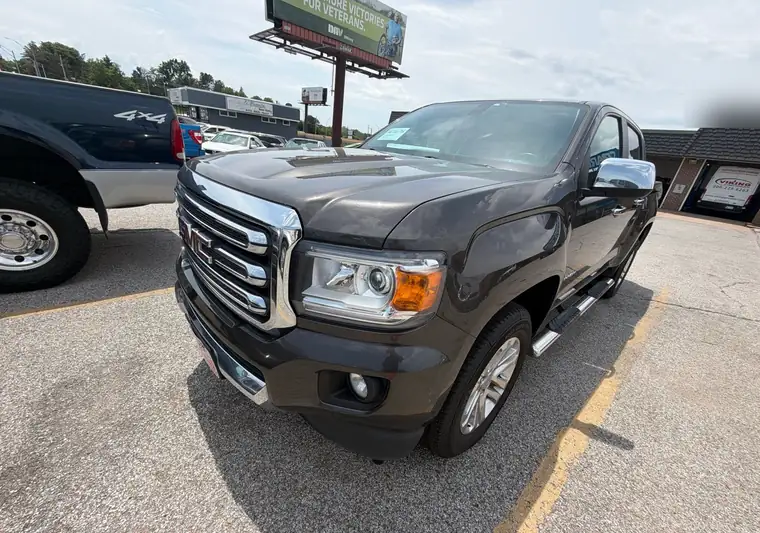 Dark gray 2019 GMC Canyon crew cab pickup in a parking lot in Omaha, Nebraska