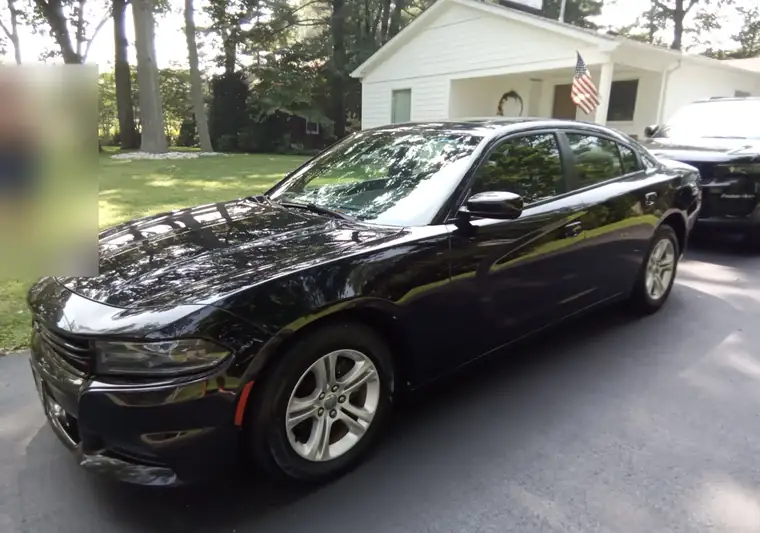 Black 2019 Dodge Charger in a driveway at pickup in Brielle, New Jersey
