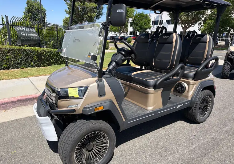 Gold and black 2026 EPIC six-seat golf cart at pickup in Corona, California