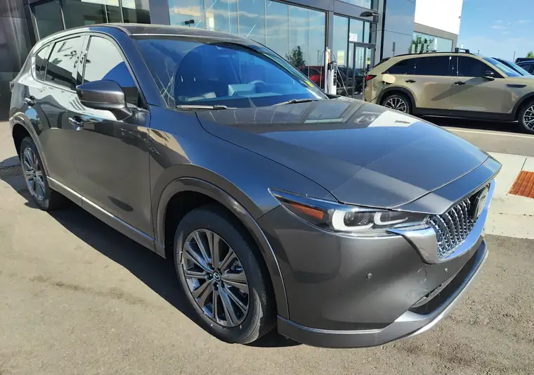 Gray 2025 Mazda CX-5 at a dealership at pickup in Loveland, Colorado