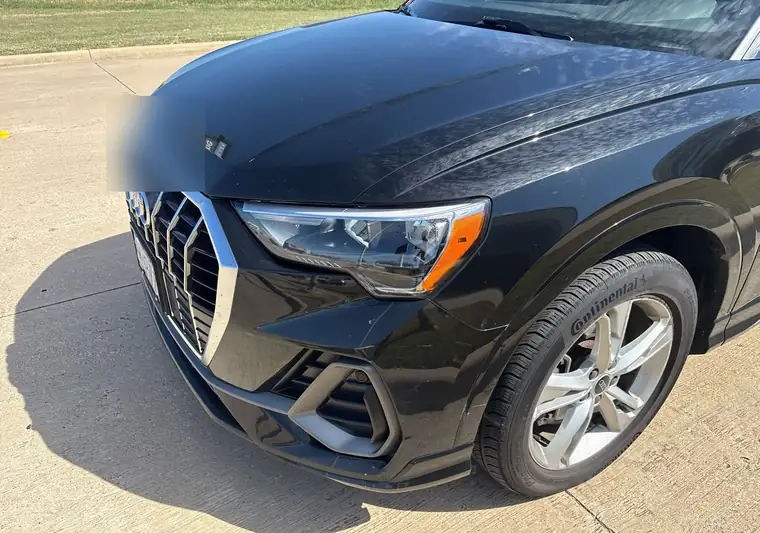 The same Audi Q3 on a concrete lot at delivery in Plano, Texas